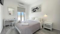 Hermoso Luxury Suitesにあるベッド