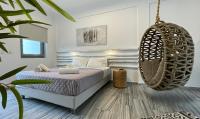 Hermoso Luxury Suitesにあるベッド
