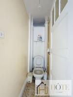 a small bathroom with a toilet in a room at Résidence Saint Pierre: Vue Mer, 2 Chambres in Bray-Dunes