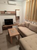 Televízia a/alebo spoločenská miestnosť v ubytovaní Apartmani G&E