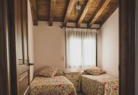 Postel nebo postele na pokoji v ubytování Apartamentos Rurales La Fatela