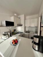Een keuken of kitchenette bij Grand studio localisation id&eacute;ale