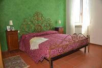 A bed or beds in a room at VILLA GHIANDARE