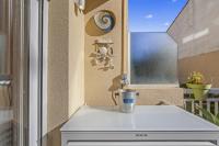 a kitchen with a counter with a coffee mug on it at Cannes NG - Appartement à 10 mn du Palais des Festivals in Cannes