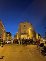 a group of people standing in the street near a building at Appartement + terrasse à 5min à pied de la mer et du Vallon des auffes in Marseille