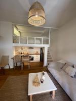 a living room with a couch and a table at Appartement + terrasse à 5min à pied de la mer et du Vallon des auffes in Marseille