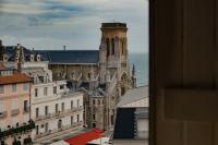 a view of a cathedral and some buildings at ALFRED HOTELS Les Halles - Ex Hotel Anjou in Biarritz