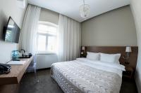 Posteľ alebo postele v izbe v ubytovaní Hotel Jakubus