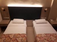 A bed or beds in a room at Hamle Hotel