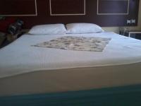 A bed or beds in a room at Hamle Hotel