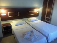 A bed or beds in a room at Hamle Hotel