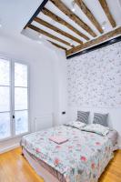 En eller flere senge i et v&aelig;relse p&aring; Marais 4 bedrooms new apartment