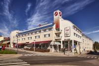 a large white building on the corner of a street at Original Sokos Hotel Vaakuna Rovaniemi in Rovaniemi