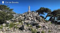a cross on top of a rocky mountain at A PIAZZOLA in Petreto-Bicchisano