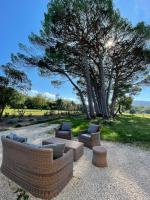 a group of couches and chairs in a park at La Pavoyère in Mormoiron