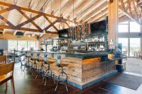 a bar with a bunch of bar stools at Snow King Resort Luxury Condominiums in Jackson