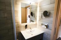 a bathroom with a sink and a mirror at PARKHOTEL - Rosarium in Uetersen