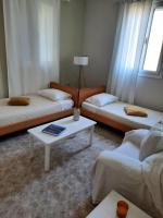 A bed or beds in a room at Arigos Apartments