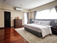 Postel nebo postele na pokoji v ubytování Floral Court Hotel & Residence Sukhumvit 13