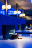 a lamp sitting on the floor next to a blue wall at Marian Resort And Spa in Prestatyn
