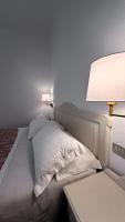 Łóżko lub łóżka w pokoju w obiekcie Hotel Terranova