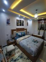 Postel nebo postele na pokoji v ubytování Sidi Beshr Luxury apartment Side Seaview