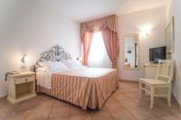 Łóżko lub łóżka w pokoju w obiekcie Hotel Terranova