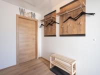 a hallway with a wooden door and a wooden bench at Haus Lilyan in Donnersbachwald