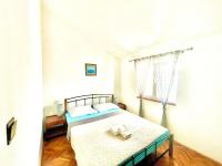 a bedroom with a bed with two towels on it at Apartments by the sea Jezera, Murter - 5123 in Jezera