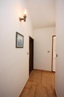 a hallway with white walls and a wooden floor at Apartments by the sea Jezera, Murter - 5123 in Jezera