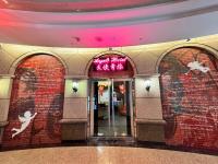 an entrance to a building with a brick wall at Angels Hostel Taipei Ximen in Taipei