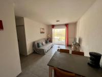 a living room with a couch and a table at San José in Juvignac