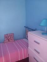 A bed or beds in a room at LENTISCHIO villetta vista mare a 250 metri dalla spiaggia con ARIA CONDIZIONATA