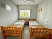 Posteľ alebo postele v izbe v ubytovaní Apartamentos Tierra de Irta 3000