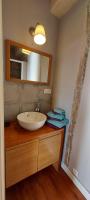 a bathroom with a white sink and a mirror at B&amp;B Bon Vivant in Brinay