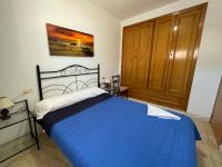 Postel nebo postele na pokoji v ubytování Bungalows Peñismar II 3000