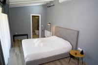 A bed or beds in a room at Ktima Faki, Olympus Mountain Accommodation & Retreat