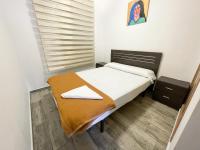 Posteľ alebo postele v izbe v ubytovaní Apartamentos Mirador del Castillo 3000