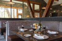 a table in a restaurant with glasses of wine at Firefall Ranch Yosemite in Groveland