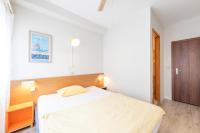 Hotel Atlantico self check-inにあるベッド