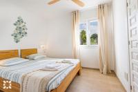 Postel nebo postele na pokoji v ubytování Villa Thalassa by Abahana Villas