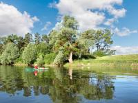 a person in a kayak on a lake at Studio avec jardin clos et wifi a Langon in Langon