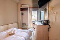 Posteľ alebo postele v izbe v ubytovaní Bikakis Family Apartments