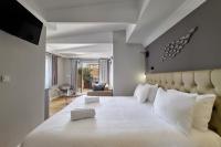 Posteľ alebo postele v izbe v ubytovaní Nival Luxury Suites