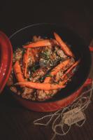 a bowl of food with carrots and meat on a table at Penthouse Chamois - LES CHALETS COVAREL in La Daille