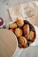 a basket of pastries and croissants in a bag at Penthouse Chamois - LES CHALETS COVAREL in La Daille