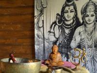 a painting of two women and a buddha on a wall at Les 5 Arches in Sisco