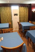 a dining room with blue tables and chairs at Emilio Hotel in Luxor