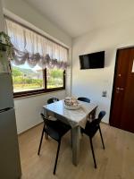 Televízia a/alebo spoločenská miestnosť v ubytovaní a casa di Ale