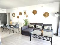 Posedenie v ubytovaní Apartamentos Las Palmeras